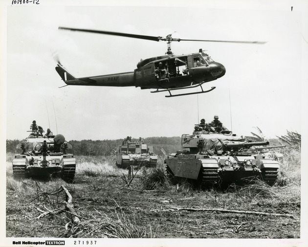 RAAF helicopter flies over tanks - 