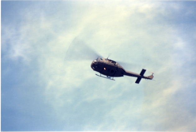Helicopter with blades in motion - 