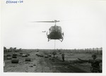 25th Infantry Division helicopter lifts barrels