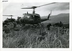 Soldiers disembark helicopter on landing zone