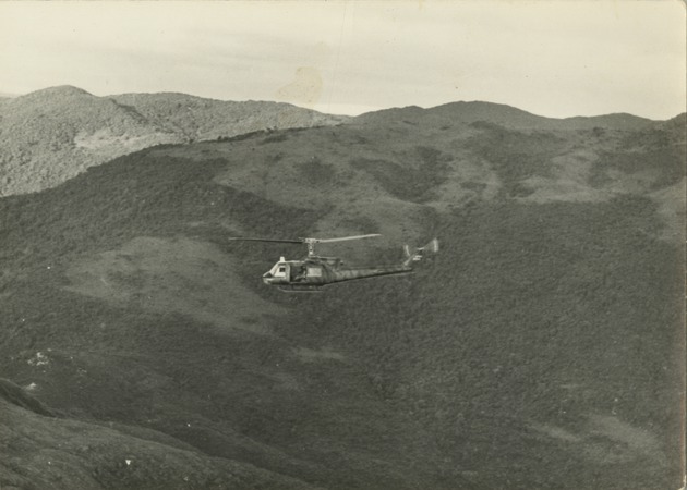 117th AHC helicopter flies over mountains - 