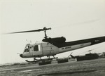Bell 204 Air America helicopter taking off