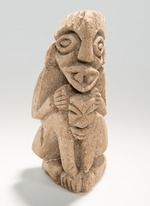 Stone figure warrior holding head of victim