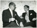 Alberto Bolet sitting beside a man