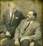 Alberto Bolet seated beside a man