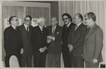 Alberto Bolet center standing with six men