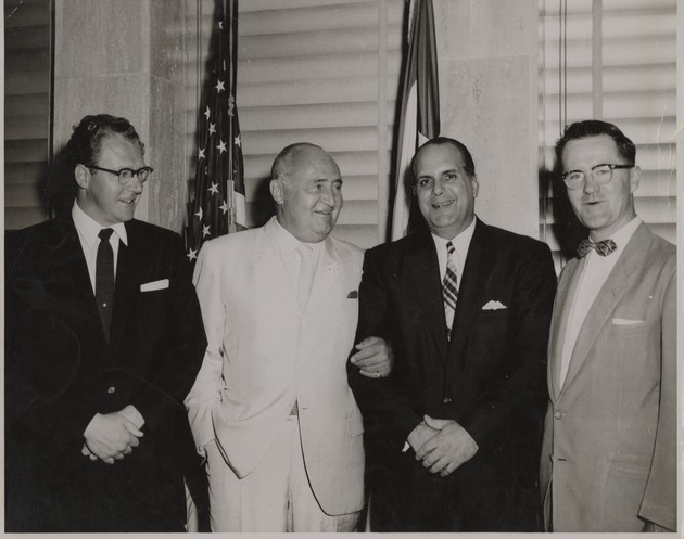 Alberto Bolet standing in a group with three other men