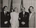 Alberto Bolet standing in a group with three other men