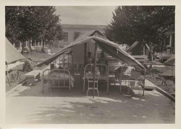Patients in hospital beds outside after 1932 earthquake - Recto