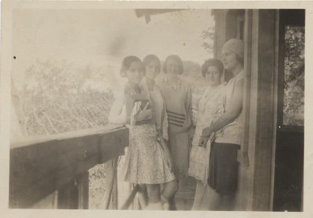 Five women standing on a porch, the House of Sweet Potato Port - Recto