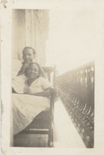 Abril Lamarque and unidentified woman sitting in chair
