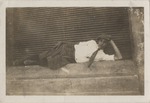 Young Eduardo Abril Lamarque laying on side