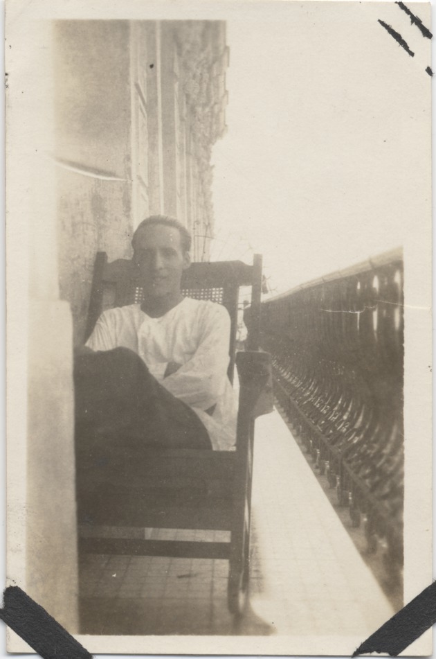 Abril Lamarque sitting in a chair outside - Recto