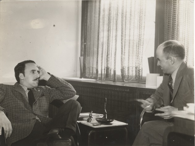 Abril Lamarque (pictured left) and unidentified man talking - Recto