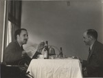 Abril Lamarque (pictured left) and unidentified man sitting at a table