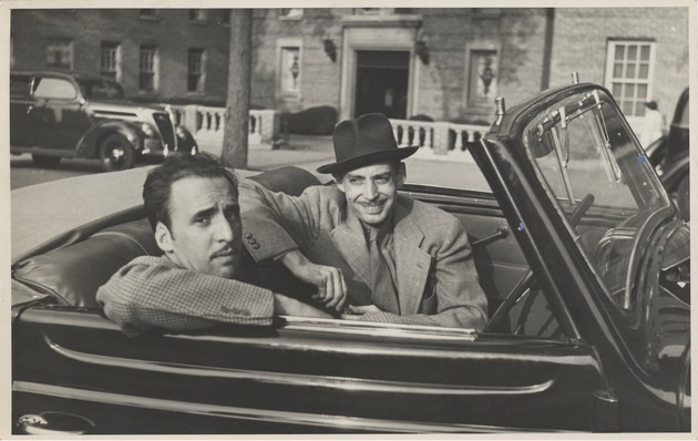Abril Lamarque (left) and unidentified man sitting in car - Recto