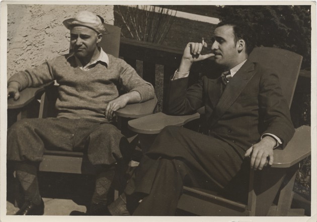 Abril Lamarque (right) and unidentified man sitting in chairs - Recto