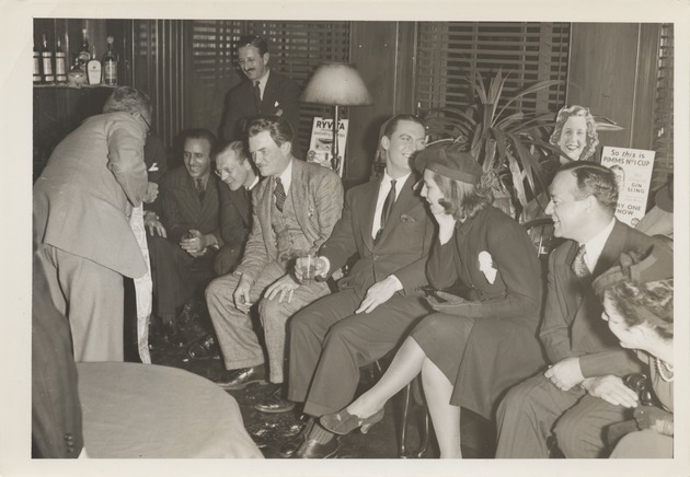 Abril Lamarque (pictured seated left) with a group of unidentified men and women - Recto