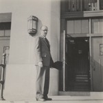 Abril Lamarque standing in front of a door