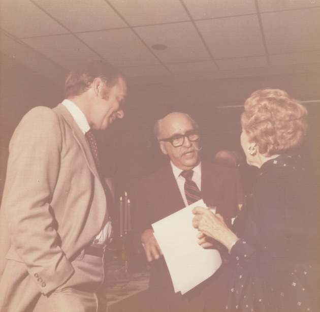 Abril Lamarque (pictured center) talking to an unidentified woman and unidentified man - Recto