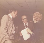 Abril Lamarque (pictured center) talking to an unidentified woman and unidentified man