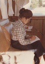 Milagros Lamarque sitting on a couch in the boat