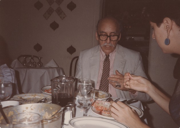 Abril Lamarque (pictured left) sitting at a dining table with unidentified woman - Recto