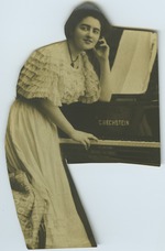 Cutout of postcard of Mana-Zucca leaning on a piano