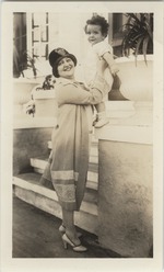 [1925/1935] Mana-Zucca standing holding Marwin Cassel