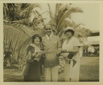Mana-Zucca, Yasha Bunchuk, and Flora Warner Lasker standing in the garden