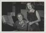 Mana-Zucca seated at a piano pictured with Joan Field
