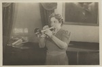 Mana-Zucca playing a trumpet