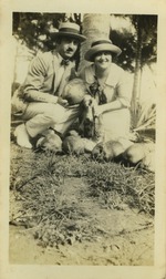 Irwin Cassel and Mana-Zucca pictured kneeling next to coconuts