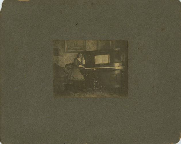 Teenage Mana-Zucca pictured next to a piano - 