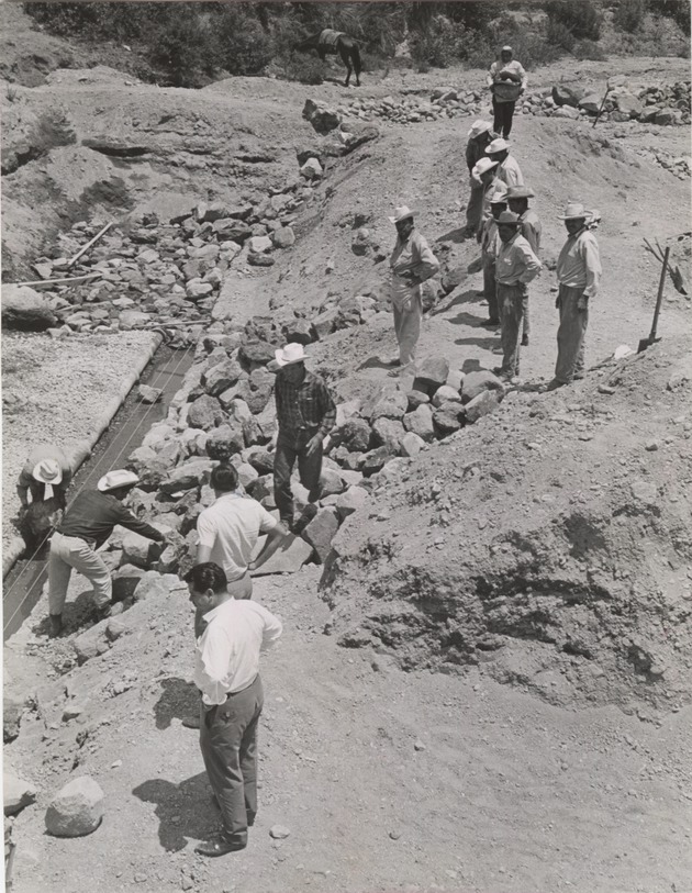 Mexican workers installing a water system - 