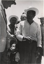 United States Ambassador to Mexico, Fulton Freeman (left), listens to a Mexican farmer
