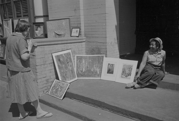 Woman with artwork in Greenwich Village