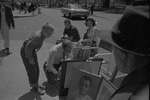 [1960-05-29] A man and young boy looking at paintings in Greenwich Village