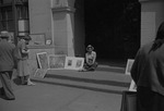 [1960-05-29] Woman with artwork in Greenwich Village