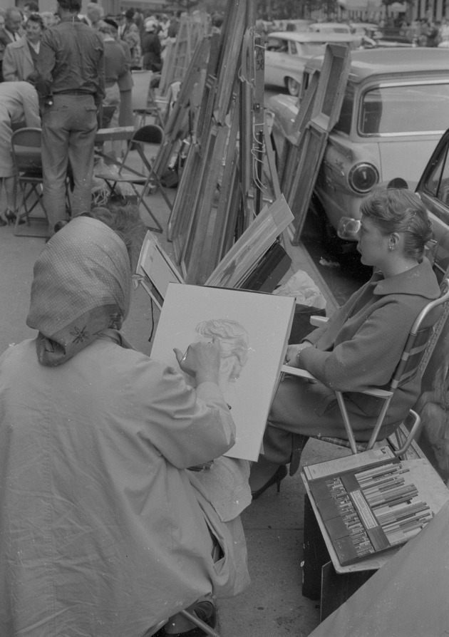 A woman drawing a woman's portrait - 