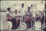 Los Diamantes band playing music on the pier