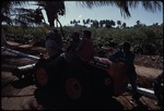 A group of men and women on tractors