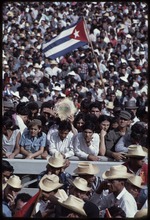 Group of men and women with a Cuban flag