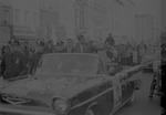 John F. Kennedy in a motorcade campaigning in Harlem