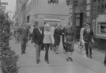 Xavier Cugat and Charo walking on East 52 Street