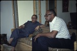 Two men sitting on a couch