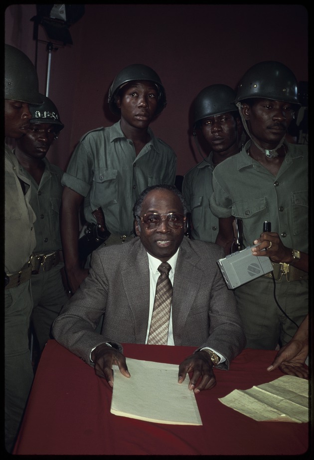 Members of the military with lawyers at a press conference