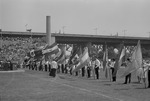 [1960-06-17] People carrying flags in the procession, San Juan Feista