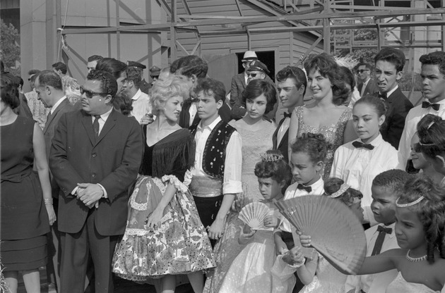 Adults and children in procession, San Juan Fiesta