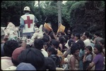 Red cross handing out rice